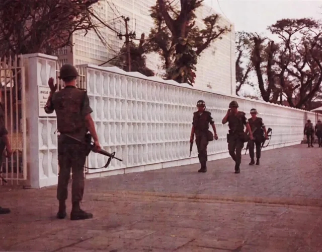 US military police at the Saigon embassy wall, photograph